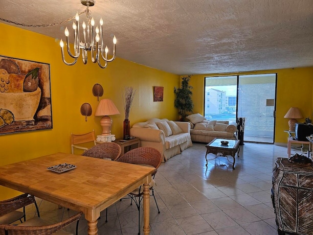 tiled dining room with a textured ceiling and a chandelier