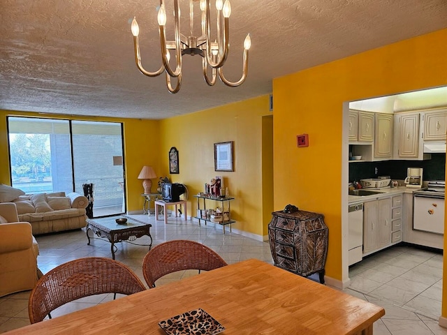 living room with an inviting chandelier, sink, light tile flooring, and a textured ceiling