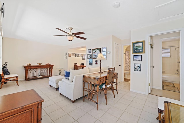 living room with ceiling fan and light tile patterned flooring