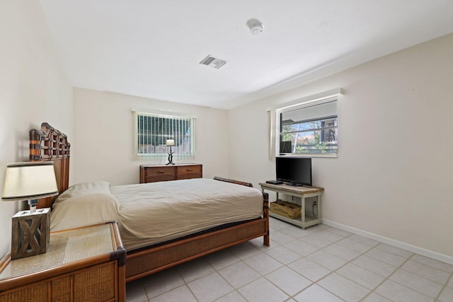 bedroom with light tile patterned flooring