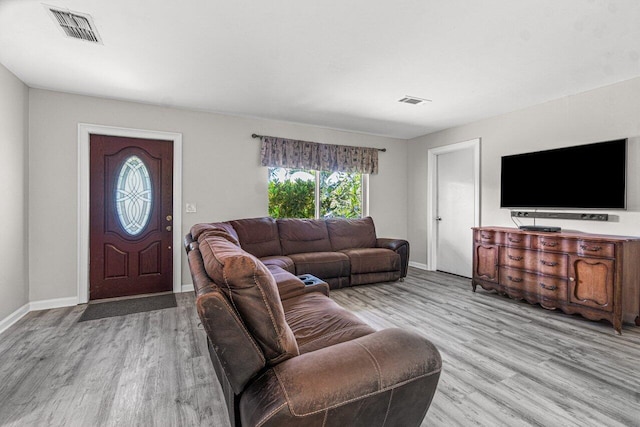 living room with light hardwood / wood-style flooring