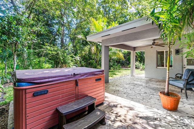 view of patio with a hot tub and ceiling fan