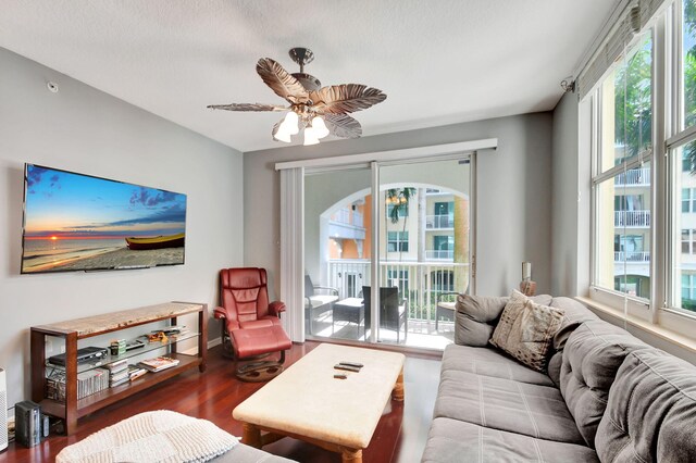 living room with hardwood / wood-style floors and ceiling fan