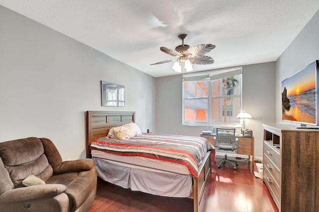 bedroom with a ceiling fan and wood finished floors