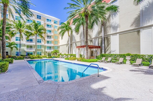 view of swimming pool featuring a patio area