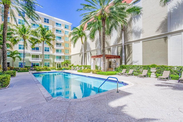 community pool with a patio area