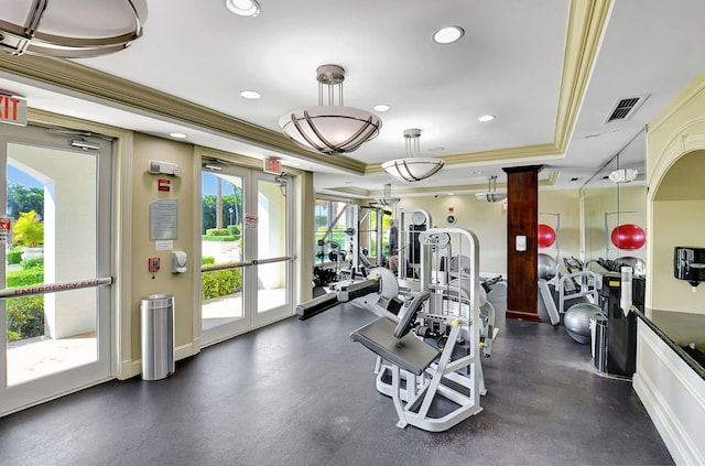 gym with visible vents, a raised ceiling, ornamental molding, french doors, and recessed lighting