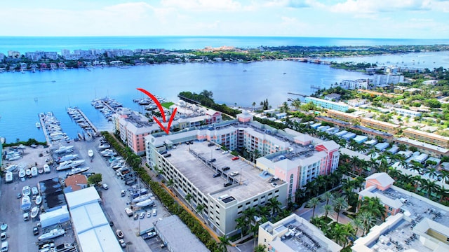 birds eye view of property with a water view