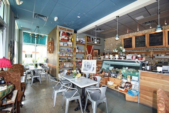 interior space featuring a drop ceiling