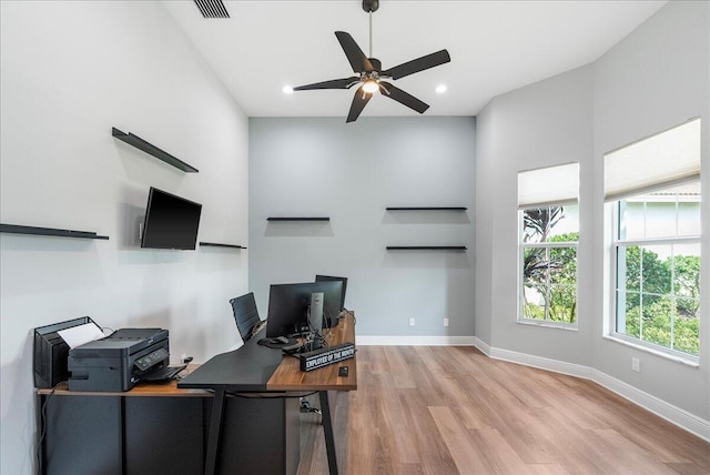 office space with recessed lighting, visible vents, baseboards, and wood finished floors