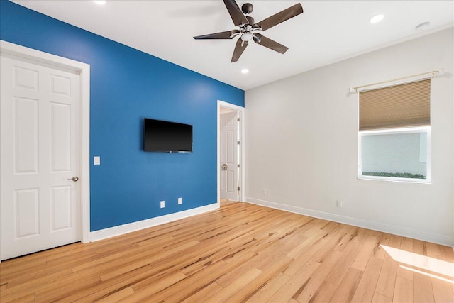 interior space featuring ceiling fan, baseboards, wood finished floors, and recessed lighting