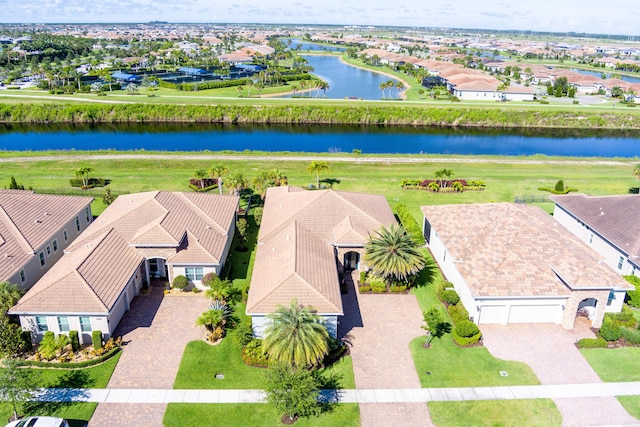 birds eye view of property featuring a water view and a residential view