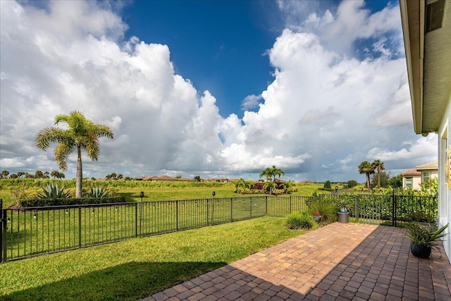 view of patio with a rural view and a fenced backyard