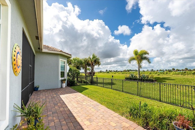 view of patio featuring a fenced backyard and a rural view