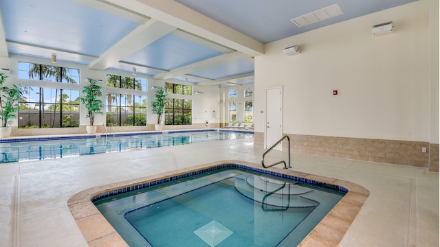 community pool featuring an indoor in ground hot tub