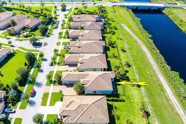 bird's eye view with a residential view and a water view