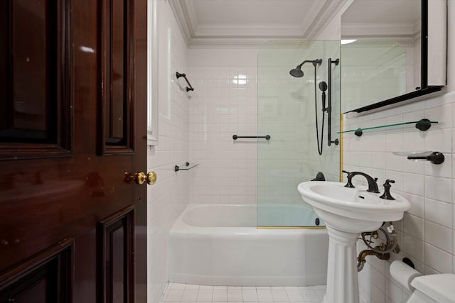 full bathroom with tile patterned flooring, tile walls, shower / washtub combination, and crown molding