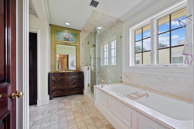 bathroom with visible vents, baseboards, ornamental molding, a bath, and a stall shower