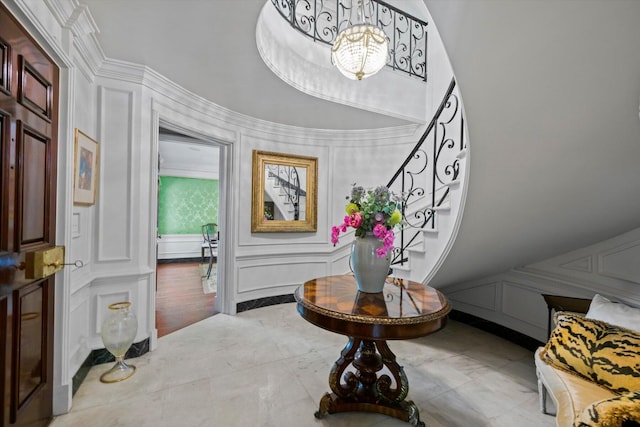 entrance foyer with a decorative wall and stairs