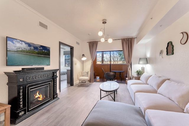 living room with wood-type flooring and a chandelier