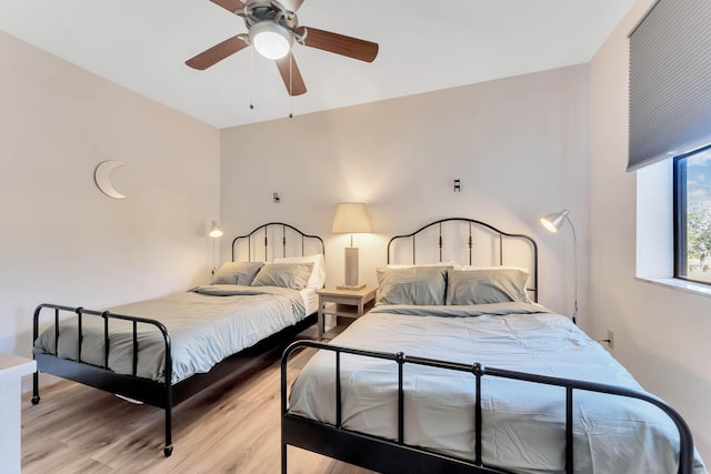 bedroom featuring a ceiling fan and light wood finished floors