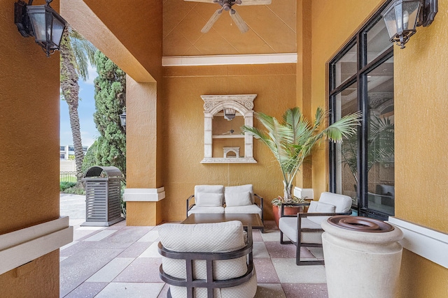 view of patio featuring ceiling fan, area for grilling, and an outdoor hangout area