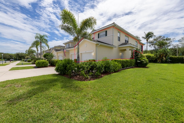 view of property exterior with a lawn and a garage