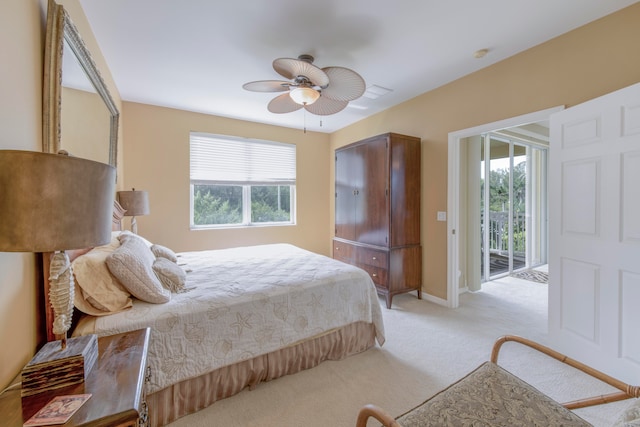 carpeted bedroom featuring ceiling fan and access to exterior