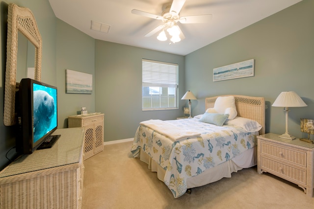 bedroom with ceiling fan and light colored carpet