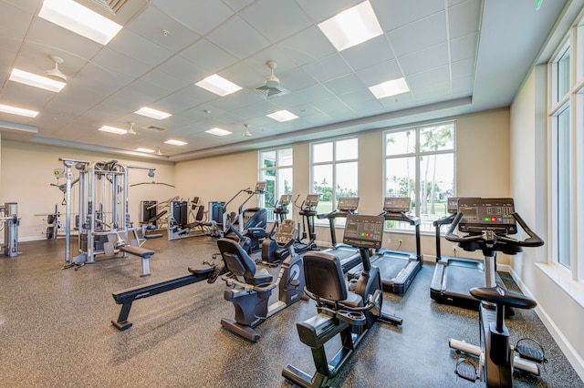 gym with a paneled ceiling