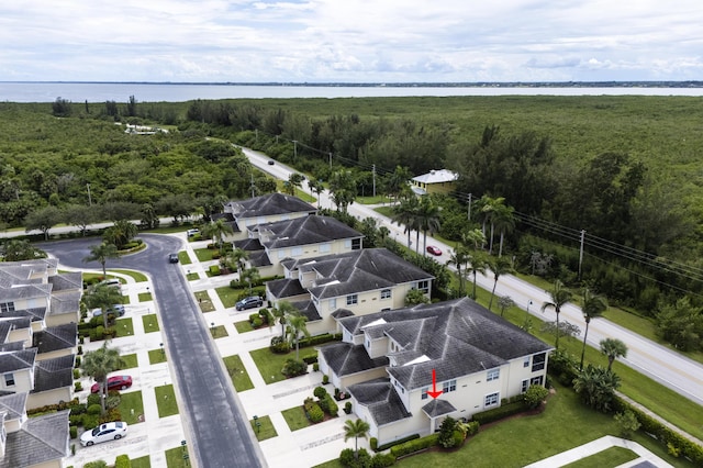 birds eye view of property featuring a water view and a residential view