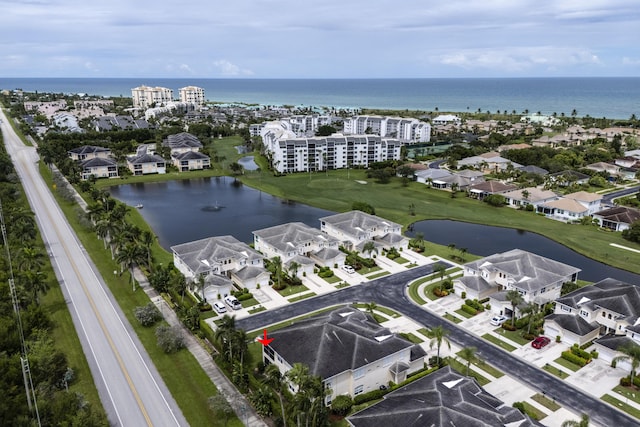 bird's eye view with a water view and a residential view