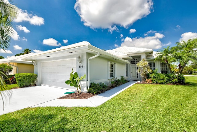 ranch-style home with a garage and a front lawn