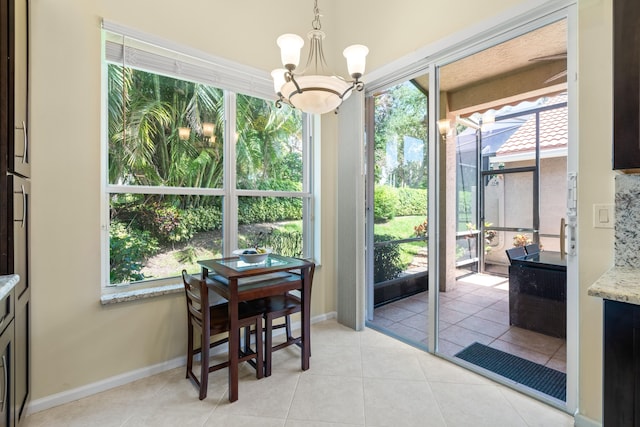 sunroom featuring a notable chandelier