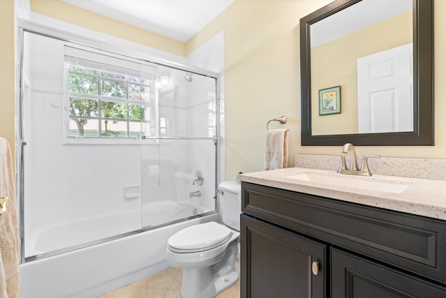 full bathroom with enclosed tub / shower combo, vanity, toilet, and tile patterned flooring