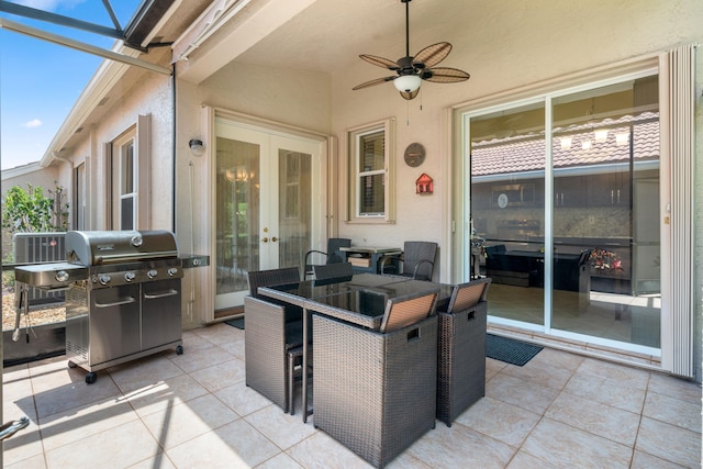 view of patio featuring a grill, glass enclosure, ceiling fan, and french doors