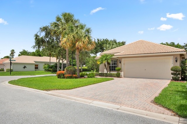 view of front facade featuring a garage and a front lawn