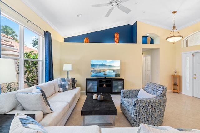 tiled living room with ceiling fan, ornamental molding, and high vaulted ceiling