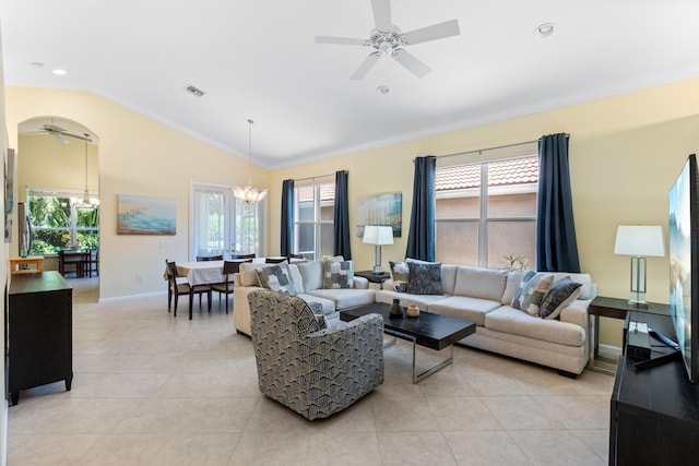 living room with lofted ceiling, light tile patterned floors, and a healthy amount of sunlight