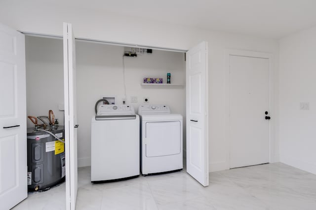 clothes washing area with washer and dryer, hookup for a washing machine, electric dryer hookup, light tile flooring, and electric water heater