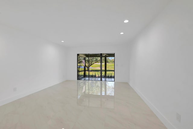 empty room featuring light tile floors