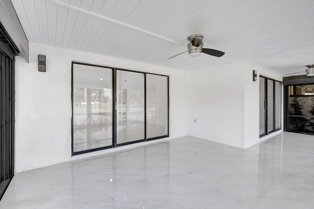 spare room featuring wooden ceiling, tile flooring, and ceiling fan