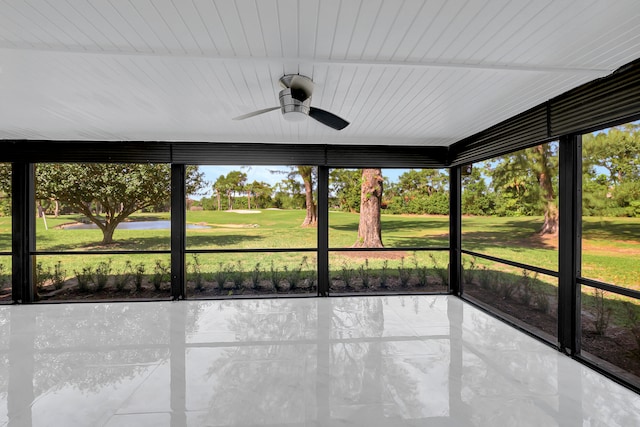 unfurnished sunroom featuring ceiling fan