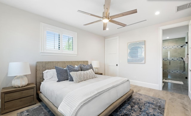 bedroom with connected bathroom, light hardwood / wood-style floors, and ceiling fan