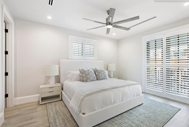 bedroom with access to outside, light hardwood / wood-style floors, and ceiling fan