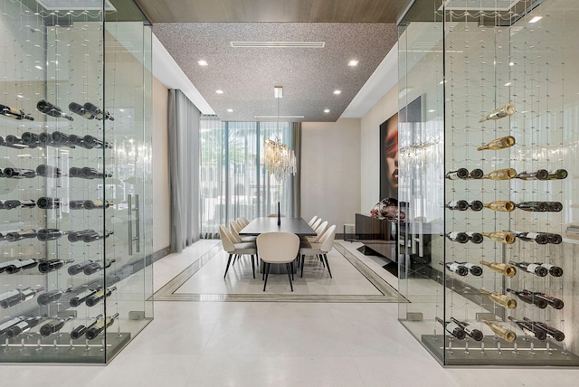 wine cellar featuring tile patterned floors and expansive windows