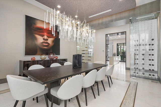 tiled dining area featuring a notable chandelier