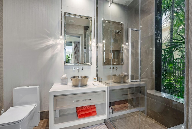 bathroom featuring a stall shower, vanity, and toilet