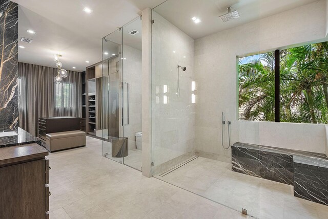 bathroom with a tile shower