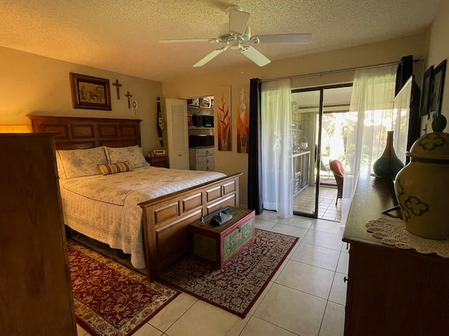 bedroom featuring a textured ceiling, access to outside, ceiling fan, and light tile patterned floors